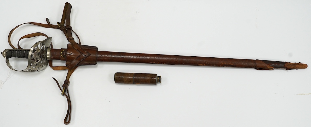 An 1895 pattern infantry officer’s sword by Wilkinson, proof number 34431, blade 82cm, in it’s leather field service scabbard with hangers and sword knot, with supporting research confirming that it was purchased by the